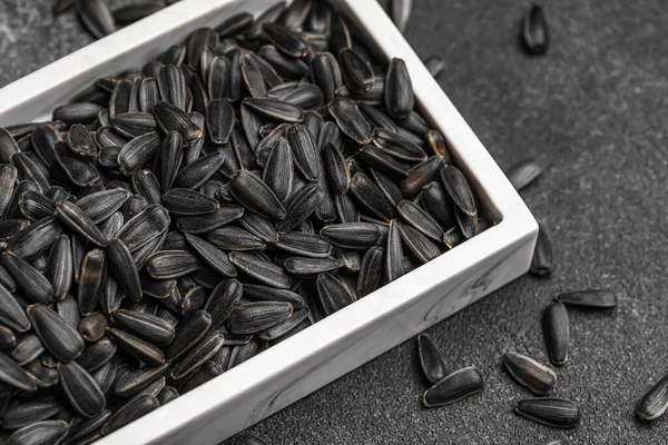 Board Black Sunflower Seeds Dark Background Closeup — Stock Photo, Image