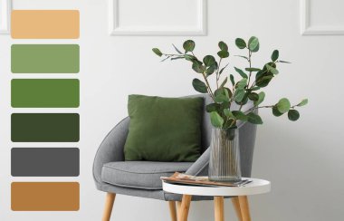 Odada okaliptüs dalları olan bir vazo. Farklı renk desenleri