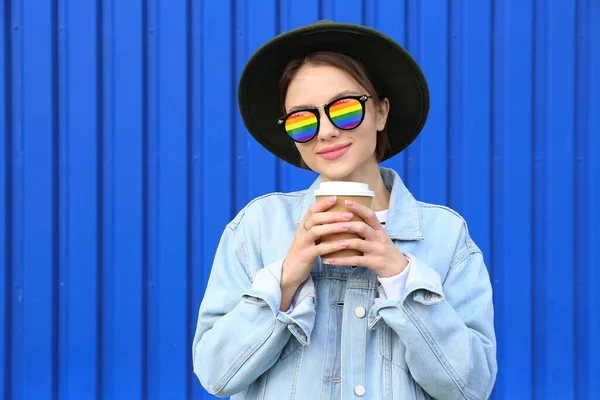 Beautiful Young Woman Coffee Wearing Stylish Rainbow Sunglasses Blue Background — Stock Photo, Image