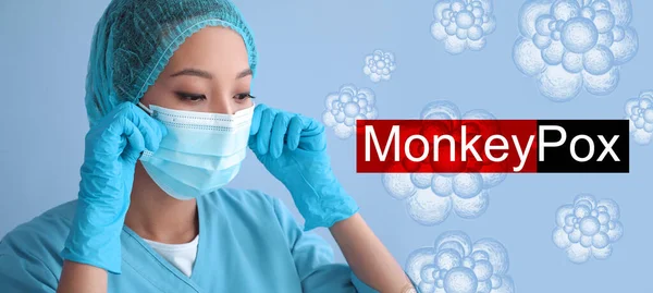 Asian nurse in medical mask and monkeypox viruses on color background