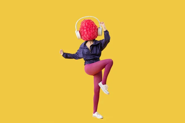 Woman Headphones Ripe Raspberry Instead Her Head Doing Aerobics Yellow — Stock Photo, Image