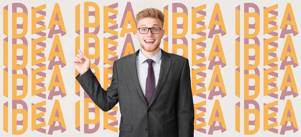 Happy businessman and many words IDEA on light background