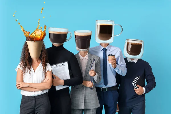 Business people with cups of hot coffee instead of their heads on light blue background