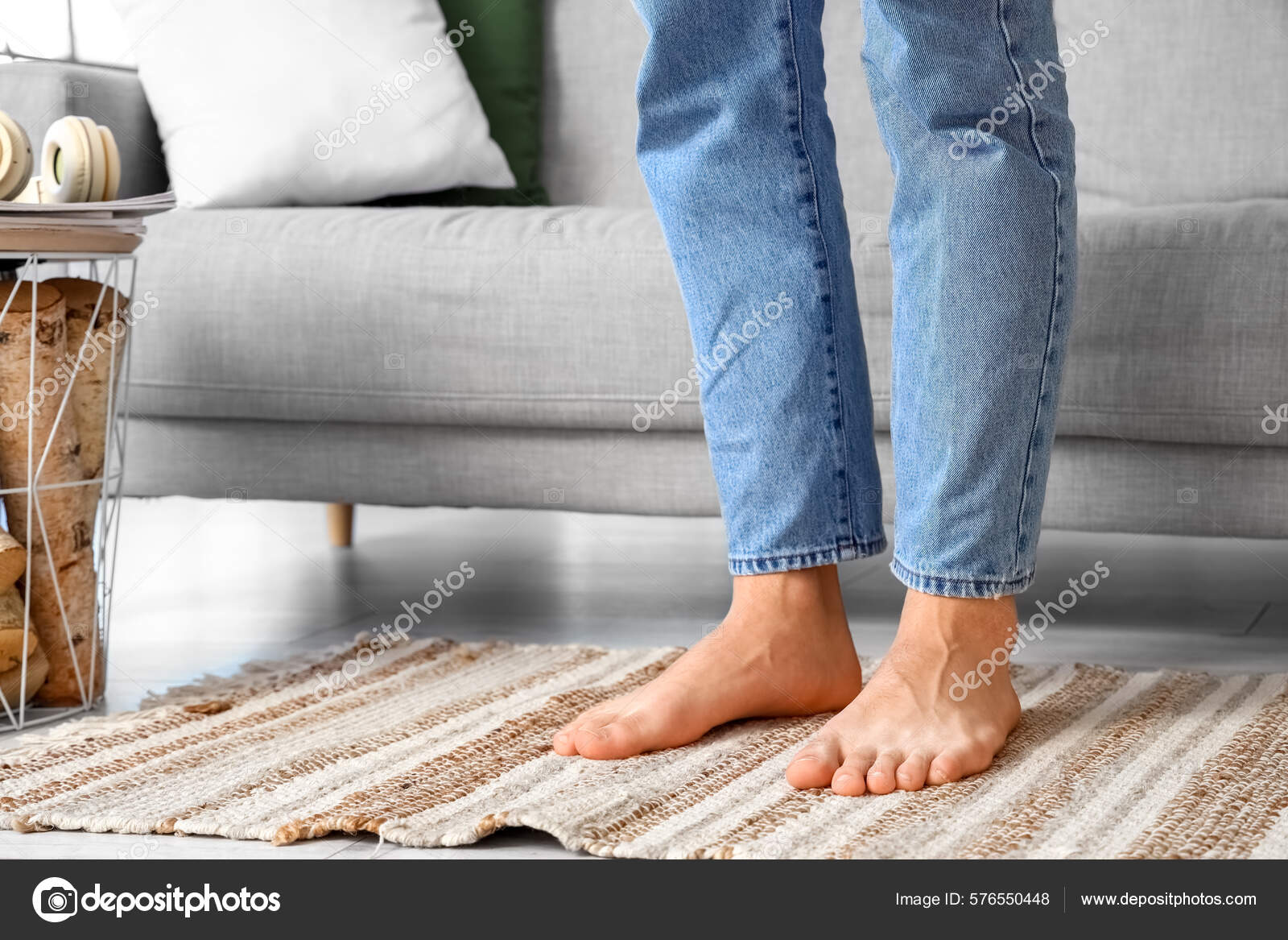 https://st.depositphotos.com/10614052/57655/i/1600/depositphotos_576550448-stock-photo-young-barefoot-man-home-closeup.jpg