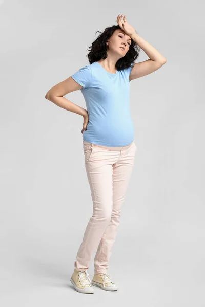 Tired Young Pregnant Woman Blue Shirt Light Background — Stock Photo, Image