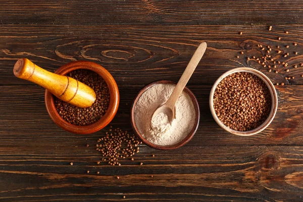Bowls Flour Buckwheat Grains Spoon Dark Wooden Background — Stock Photo, Image