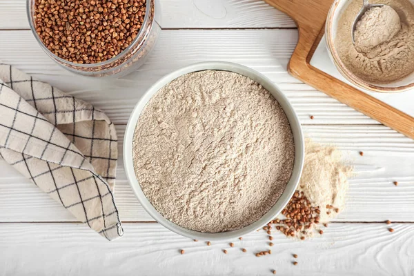 Bowls Flour Buckwheat Grains Napkin Board White Wooden Background — Stock Photo, Image