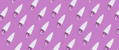 Leylak arka planında birçok şemsiye var. Tasarım için desen