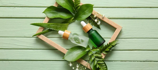 Composition Bottles Natural Cosmetics Plant Leaves Green Wooden Background — Stock Photo, Image