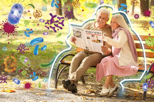 Loving Mature Couple Reading Newspaper Autumn Park Concept Strong Immunity — Stock Photo, Image