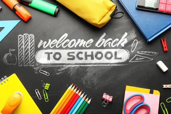 Text WELCOME BACK TO SCHOOL and set of stationery on blackboard