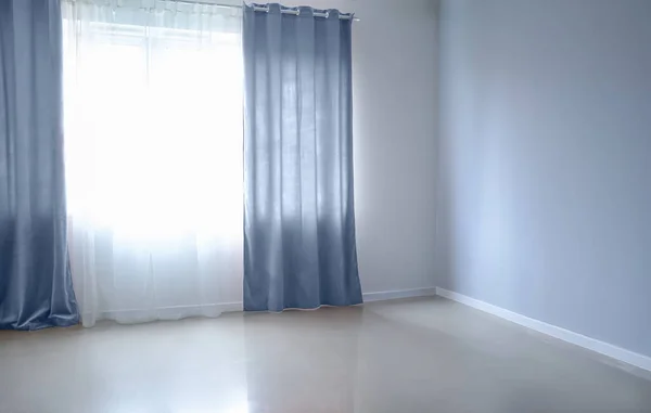 Beautiful curtains in cozy empty room