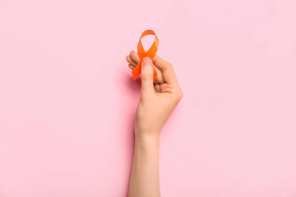 Woman Orange Awareness Ribbon Pink Background Kidney Cancer Concept — Stock Photo, Image