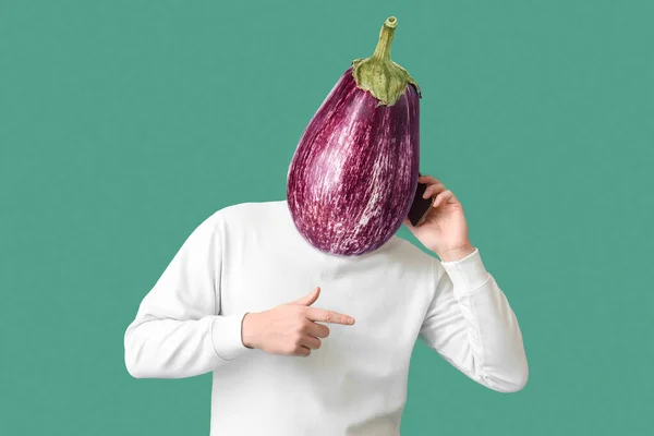 Man Fresh Eggplant Instead His Head Mobile Phone Green Background — Stockfoto