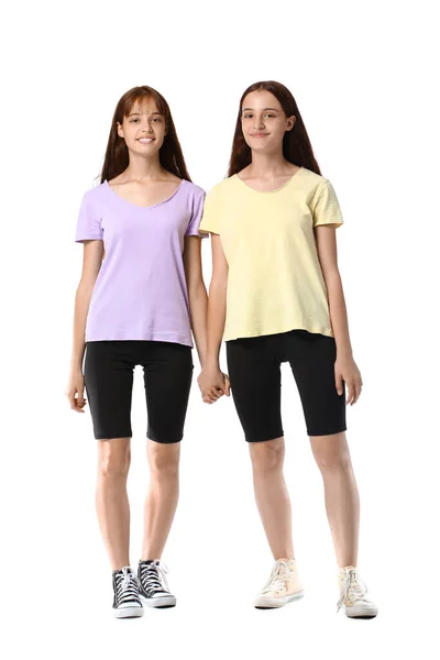 Teenage Twin Sisters Holding Hands White Background — Stock Photo, Image