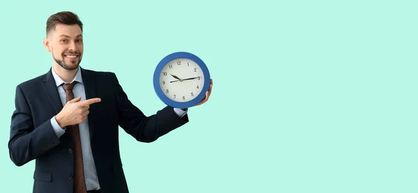 Businessman Holding Clock Turquoise Background Space Text Time Management Concept — Stockfoto