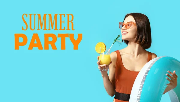 Young woman with cocktail and inflatable ring on blue background with text SUMMER PARTY