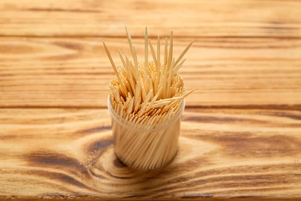 Plastic Holder Toothpicks Wooden Background — Stock Photo, Image