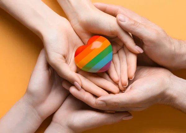 People Holding Rainbow Heart Yellow Background Top View Lgbt Concept — Stockfoto