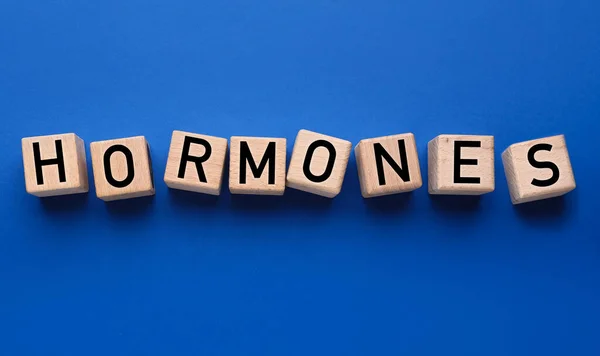 Word Hormones Made Cubes Blue Background — Stock Photo, Image