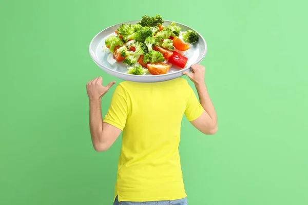 Young Man Plate Tasty Caesar Salad Instead His Head Green — Stock Photo, Image