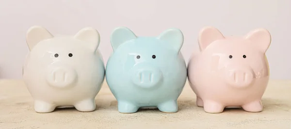 Piggy Banks Table Light Background — Stock Photo, Image