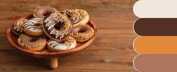 Stand Tasty Donuts Wooden Table Different Color Patterns — Stock Photo, Image