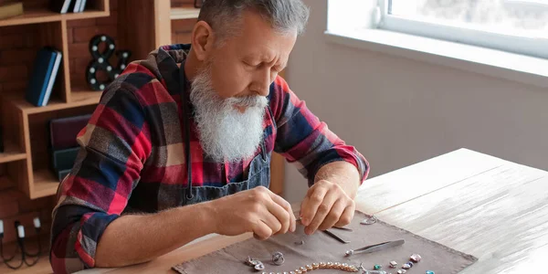 Mature Jeweller Examining Gemstone Workshop — Stock Photo, Image