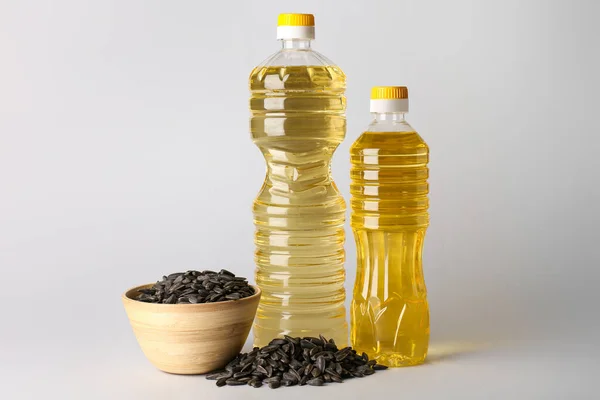 Bottles Fresh Oil Bowl Sunflower Seeds Grey Background — Stock Photo, Image