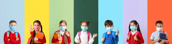 Nombreux Écoliers Portant Des Masques Médicaux Sur Fond Coloré — Photo