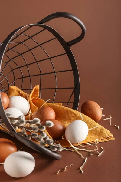 Overturned Basket Different Chicken Eggs Pussy Willow Branches Color Background — Fotografia de Stock