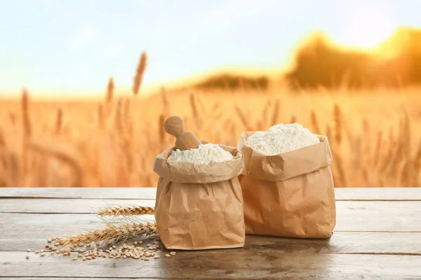 Paper Bags Wheat Flour Wooden Table Field — Stock Photo, Image