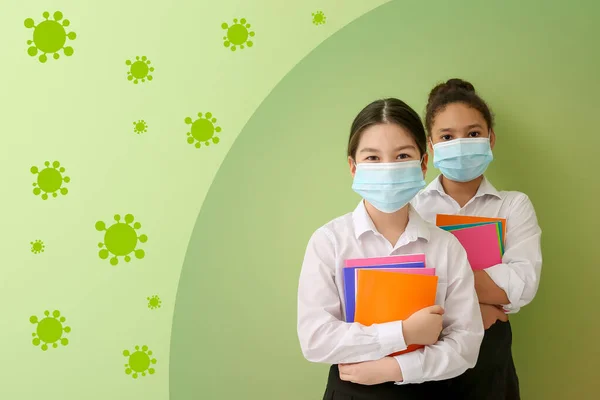 Cute Little Schoolgirls Wearing Medical Masks Drawn Coronavirus Green Background — Stock Photo, Image