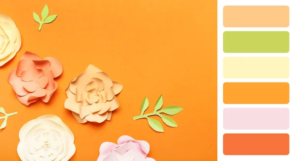 주황색 배경에는 손으로 아름다운 꽃들이 색깔의 — 스톡 사진