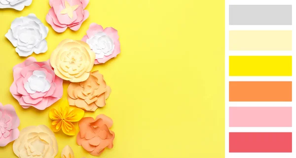 Beautiful handmade paper flowers on yellow background. Different color patterns