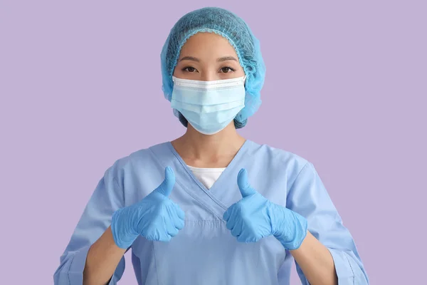 Asian Nurse Medical Mask Showing Thumb Color Background — Stockfoto