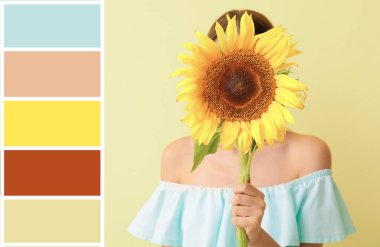 Işıklı arka planda güzel ayçiçeği olan bir kadın. Farklı renk desenleri