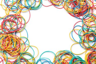 Frame made of different rubber bands on white background