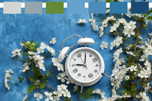 Blooming Spring Branches Alarm Clock Blue Background Different Color Patterns — Stock fotografie