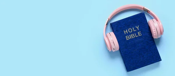 Holy Bible Modern Headphones Light Blue Background Space Text Concept — Zdjęcie stockowe