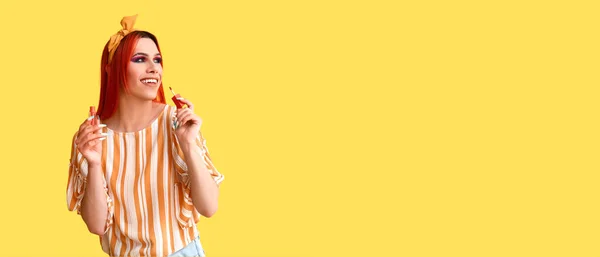 Stylish Transgender Woman Applying Lipstick Yellow Background Space Text — Stockfoto
