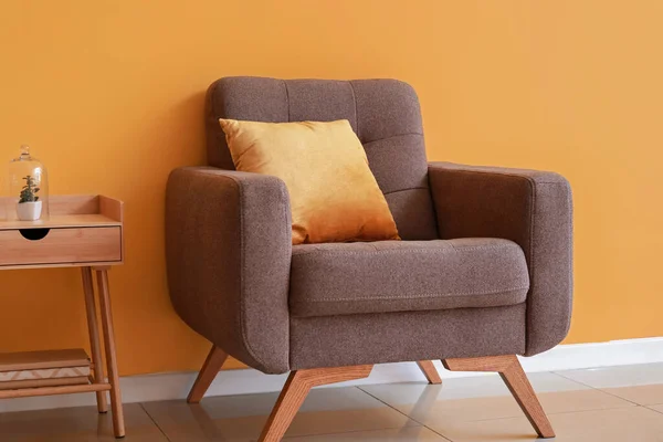 Soft Armchair Wooden Table Orange Wall — Foto Stock