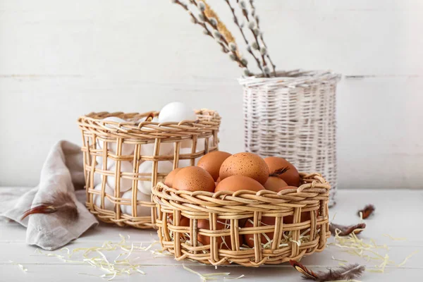 Wicker Baskets Chicken Eggs White Wooden Table — Stok fotoğraf