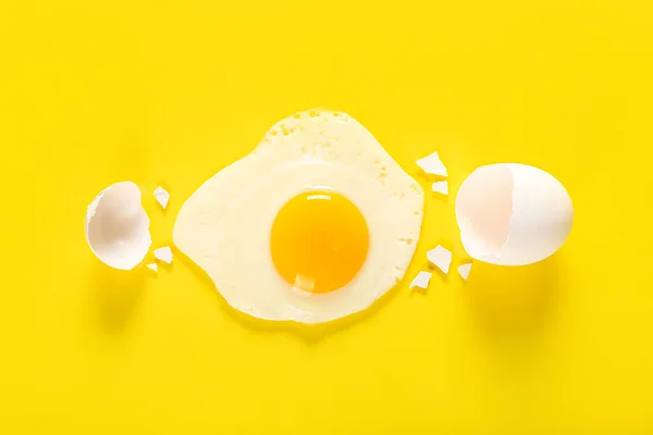 Composition Tasty Fried Egg Shell Yellow Background — Stockfoto