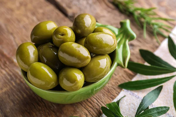 Bowl Tasty Canned Green Olives Wooden Table — Foto de Stock