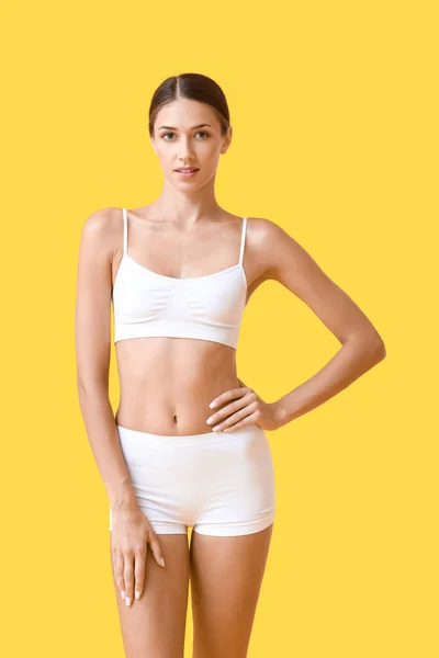 Young Tanned Woman Underwear Yellow Background — Stock fotografie