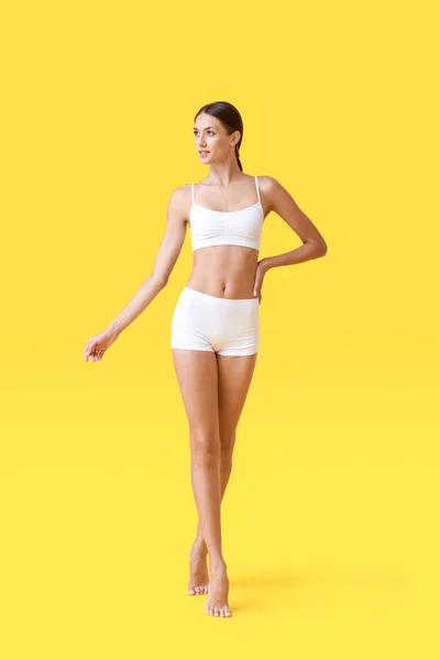 Young Tanned Woman Underwear Yellow Background — Stock fotografie