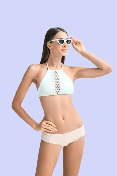 Young Tanned Woman Swimsuit Sunglasses Lilac Background — Stok fotoğraf