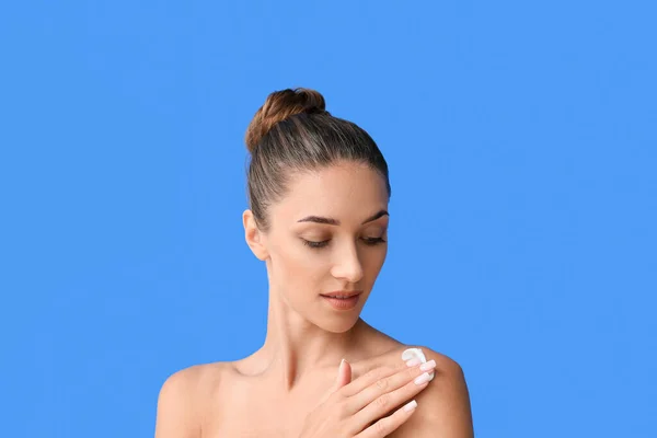 Young Tanned Woman Applying Sunscreen Cream Blue Background Closeup — Fotografia de Stock