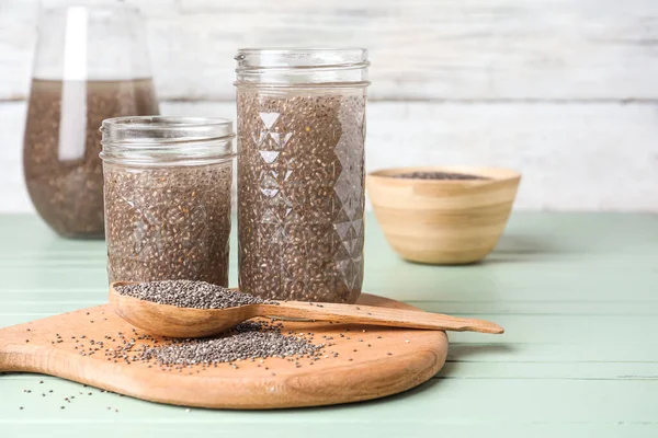 Glasses Water Chia Seeds Board Spoon Color Wooden Background — Photo